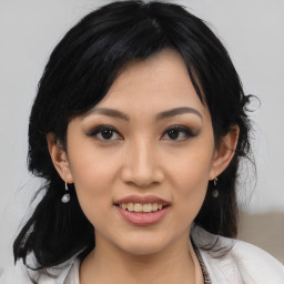 Joyful asian young-adult female with medium  black hair and brown eyes