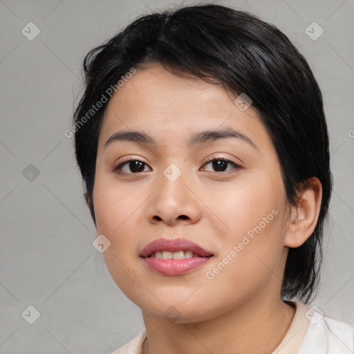 Joyful asian young-adult female with medium  black hair and brown eyes