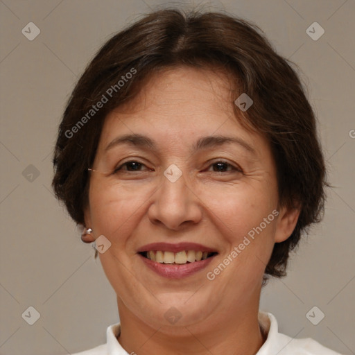 Joyful white adult female with short  brown hair and brown eyes