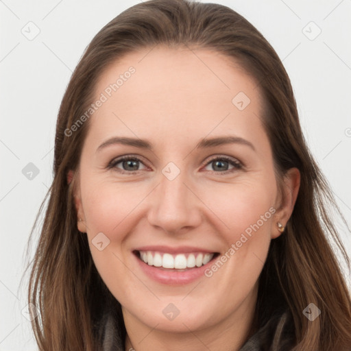 Joyful white young-adult female with long  brown hair and grey eyes