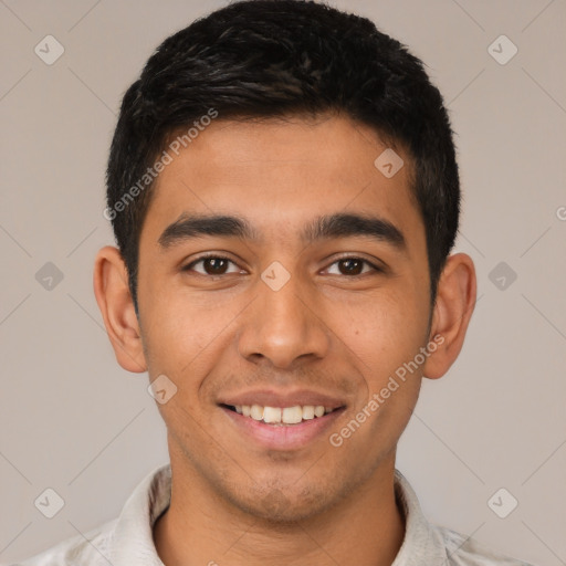 Joyful latino young-adult male with short  brown hair and brown eyes