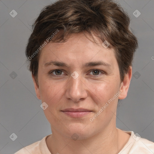 Joyful white young-adult female with short  brown hair and grey eyes