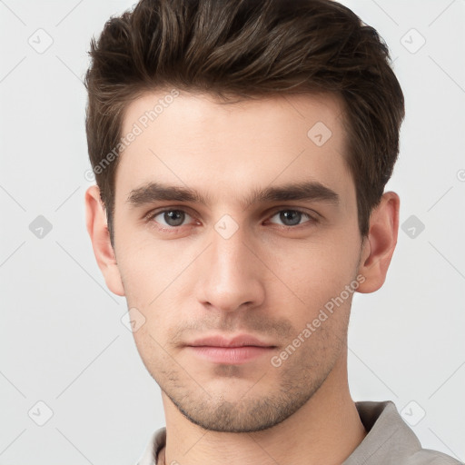 Neutral white young-adult male with short  brown hair and grey eyes