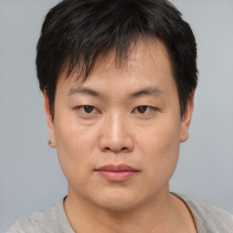 Neutral asian young-adult male with short  brown hair and brown eyes