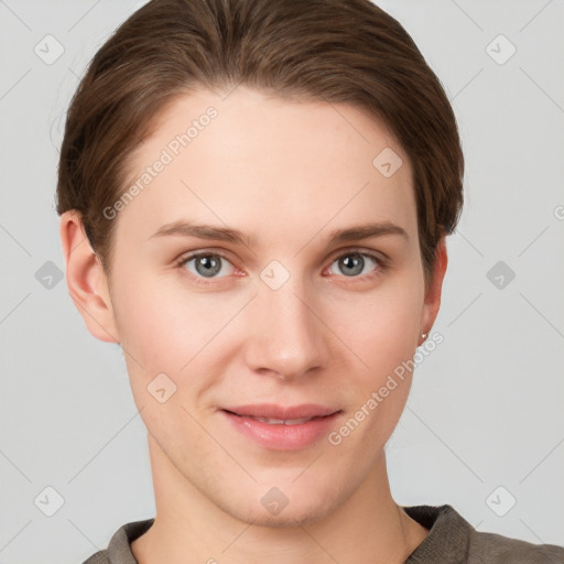 Joyful white young-adult female with short  brown hair and grey eyes