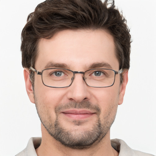 Joyful white adult male with short  brown hair and grey eyes