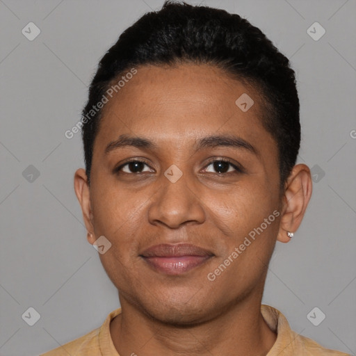 Joyful black young-adult male with short  brown hair and brown eyes