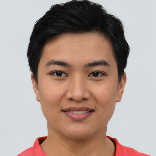 Joyful asian young-adult female with short  brown hair and brown eyes