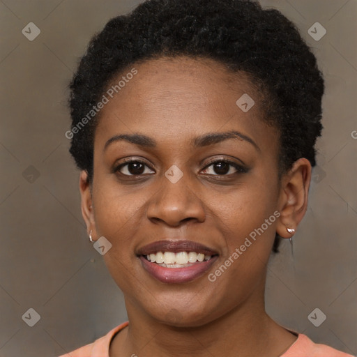 Joyful black young-adult female with short  brown hair and brown eyes