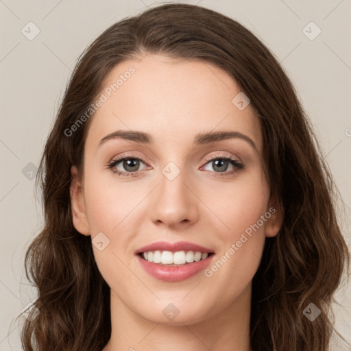 Joyful white young-adult female with long  brown hair and green eyes