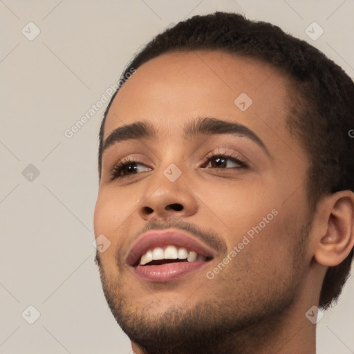 Joyful white young-adult male with short  black hair and brown eyes