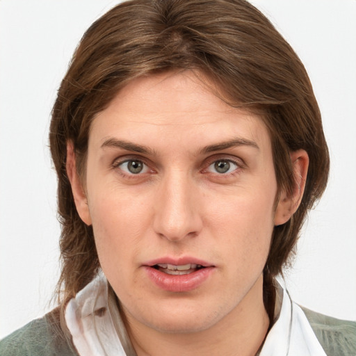 Joyful white young-adult female with medium  brown hair and green eyes