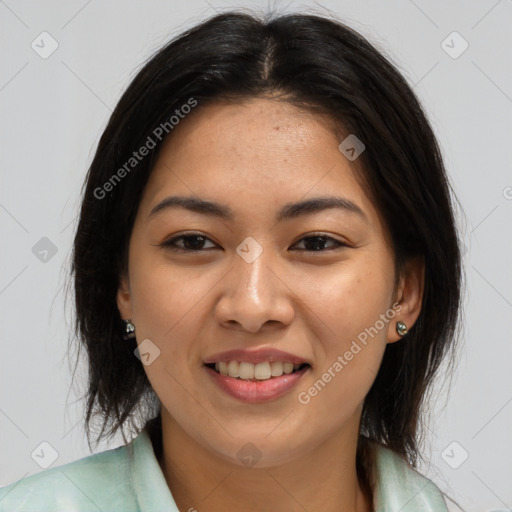 Joyful asian young-adult female with long  brown hair and brown eyes