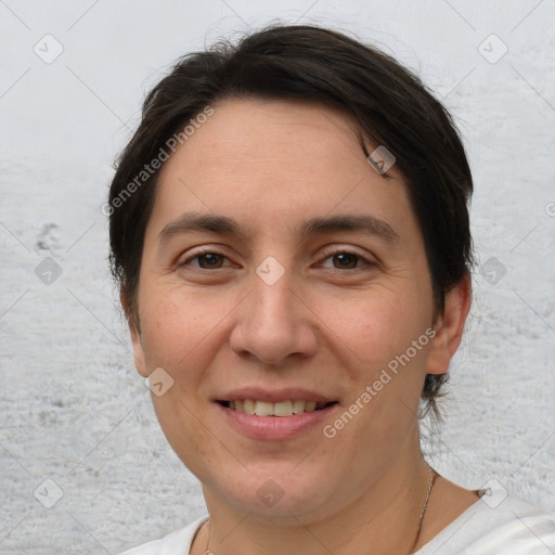 Joyful white adult female with short  brown hair and brown eyes