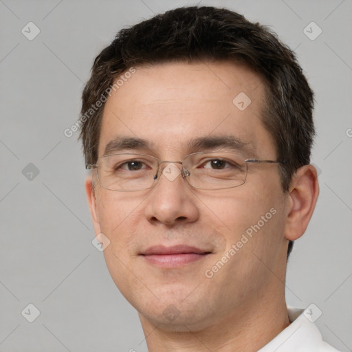 Joyful white adult male with short  brown hair and brown eyes