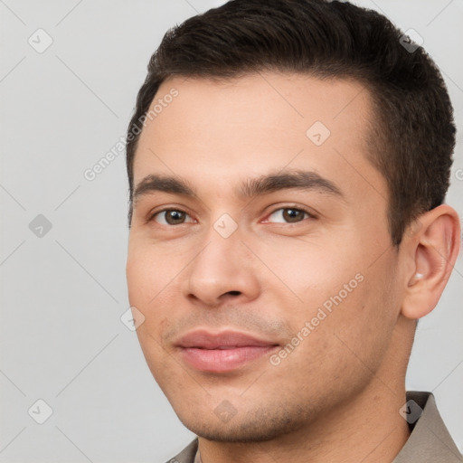 Joyful white young-adult male with short  brown hair and brown eyes