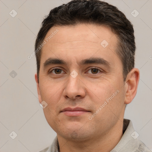 Joyful white adult male with short  brown hair and brown eyes