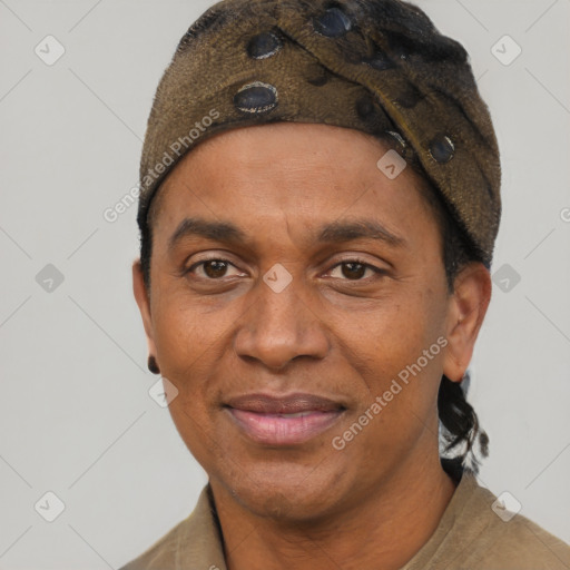 Joyful black adult male with short  brown hair and brown eyes