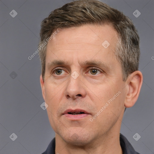 Neutral white adult male with short  brown hair and brown eyes