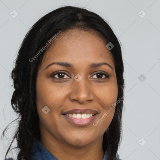 Joyful black young-adult female with long  brown hair and brown eyes