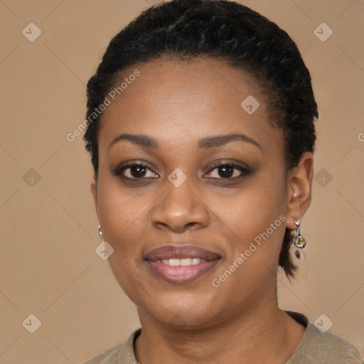 Joyful black young-adult female with short  black hair and brown eyes