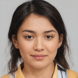 Joyful latino young-adult female with medium  brown hair and brown eyes