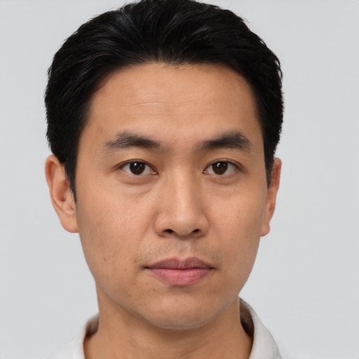 Neutral asian young-adult male with short  black hair and brown eyes