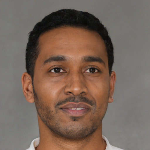 Neutral black young-adult male with short  black hair and brown eyes