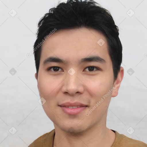 Joyful asian young-adult male with short  black hair and brown eyes