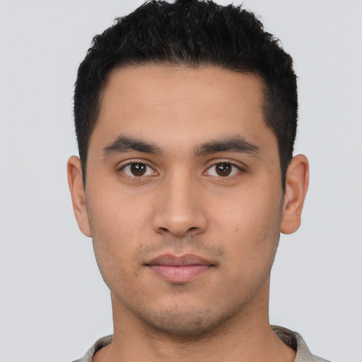 Neutral latino young-adult male with short  black hair and brown eyes
