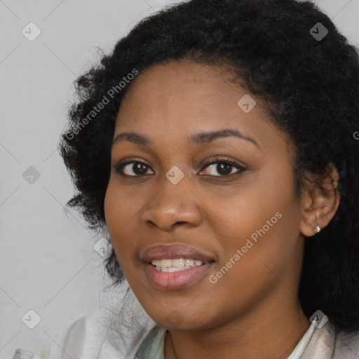 Joyful black young-adult female with medium  black hair and brown eyes