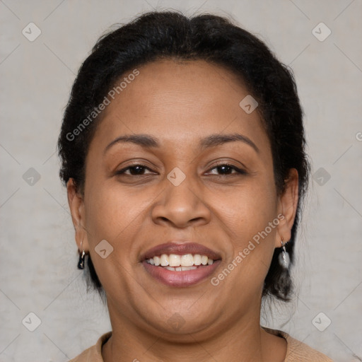 Joyful latino adult female with short  brown hair and brown eyes