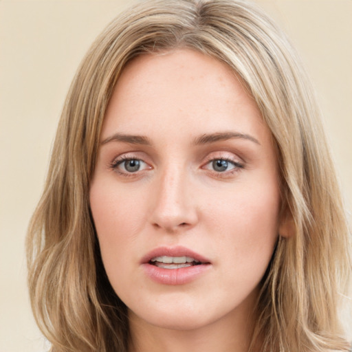 Neutral white young-adult female with long  brown hair and green eyes