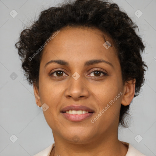 Joyful latino young-adult female with short  brown hair and brown eyes