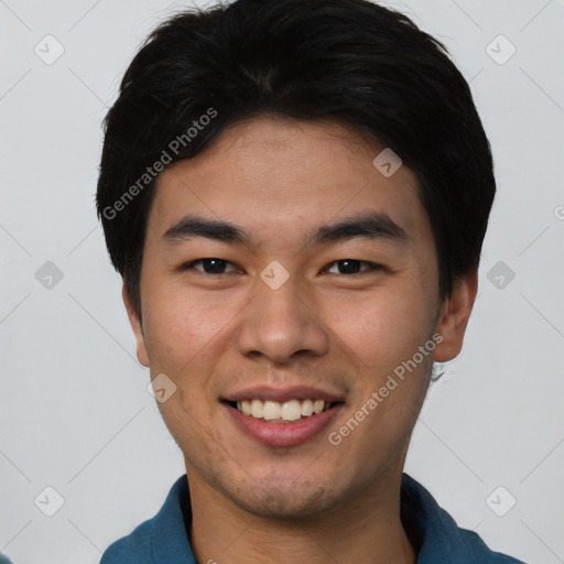 Joyful asian young-adult male with short  black hair and brown eyes