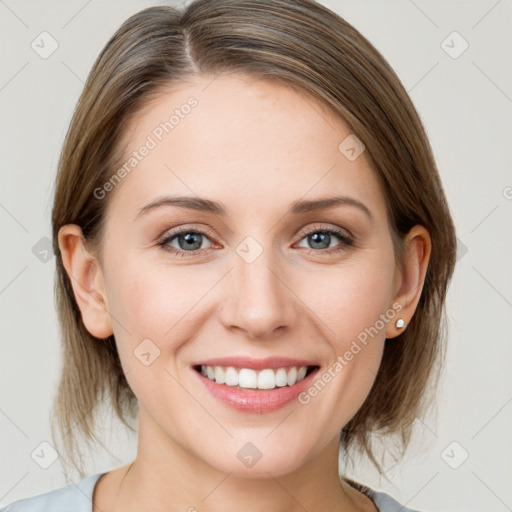 Joyful white young-adult female with medium  brown hair and grey eyes