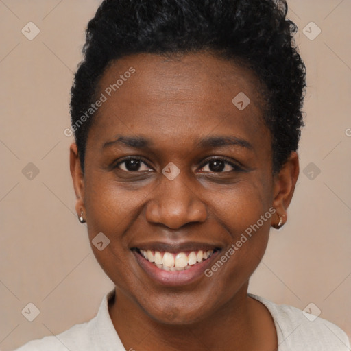 Joyful black young-adult female with short  brown hair and brown eyes