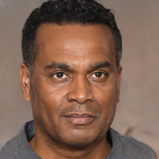 Neutral black adult male with short  black hair and brown eyes