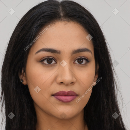 Joyful latino young-adult female with long  brown hair and brown eyes