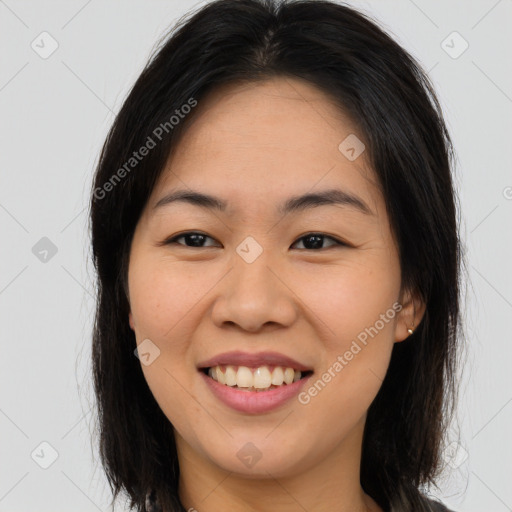 Joyful asian young-adult female with long  brown hair and brown eyes