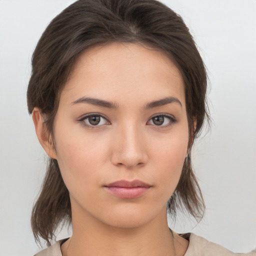 Neutral white young-adult female with medium  brown hair and brown eyes