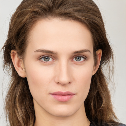 Neutral white young-adult female with long  brown hair and brown eyes