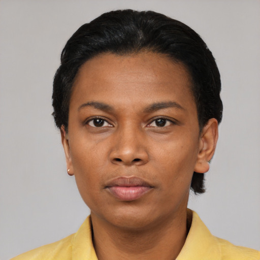 Neutral black young-adult female with short  black hair and brown eyes