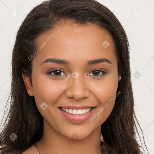 Joyful latino young-adult female with long  brown hair and brown eyes