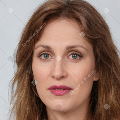 Joyful white young-adult female with long  brown hair and green eyes