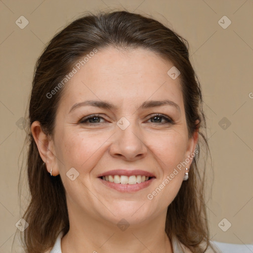 Joyful white adult female with medium  brown hair and brown eyes