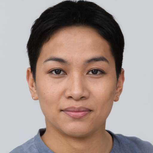 Joyful asian young-adult female with short  black hair and brown eyes