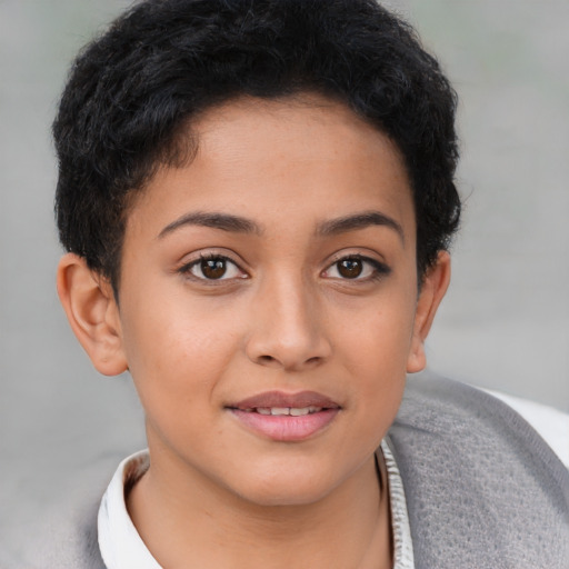 Joyful latino young-adult female with short  brown hair and brown eyes