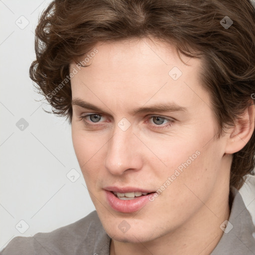 Joyful white young-adult male with medium  brown hair and brown eyes