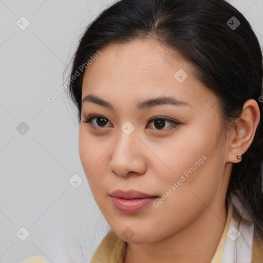 Joyful asian young-adult female with medium  brown hair and brown eyes